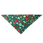 Christmas-themed dog bandana with festive patterns including snowflakes, stars, mittens, and ornaments on a green background.